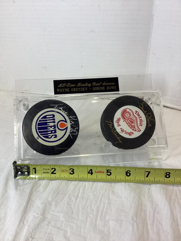 Wayne Gretzky/Gordie Howe Signed Pucks & Case: Wayne Gretzky/Gordie Howe Signed Pucks & Case