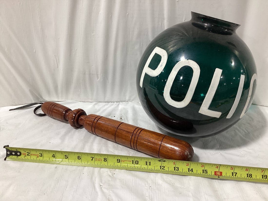 Police green globe and small billy club: Police green globe and small billy club