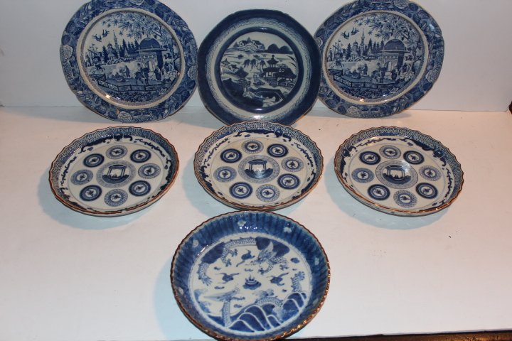 Seven blue and white oriental plates, four matching: Seven blue and white oriental plates, four matching with a small pie crust edge chips 8 1/2"D, two matching with an Oriental village scene 9 3/4"D and an early blue & white single with an Oriental vil