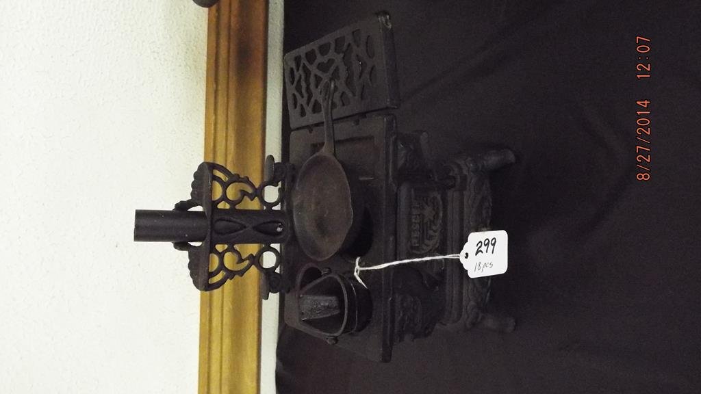 Two cast iron children's toy stoves and utensils,: Two cast iron children's toy stoves and utensils, "Baby" 8 3/4"H 15 1/2"L 8 1/4"D one stove lid missing & "crescent" 8 1/4"H 7 1/2"L 4 1/4"D one stove lid is missing including sixteen assorted utensil