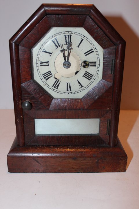 Four time pieces, Heco seven jewel musical boudoir: Four time pieces, Heco seven jewel musical boudoir clock with original paint & floral decoration 3 1/2"H, Seth Thomas clock in an ornate brass book case made in Germany 3"H, security stopwatch & a Set