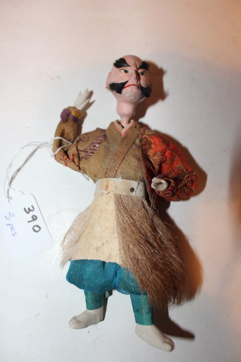 Three pieces, three Japanese Kubuki dolls, samurai on a: Three pieces, three Japanese Kubuki dolls, samurai on a wooden plateau 10 1/4"H including plateau, girl with porcelain face & hands on a wooden base 4 3/4" & an oriental gentleman 6"H