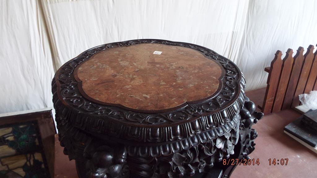Heavily carved Oriental teak stand with marble insert: Heavily carved Oriental teak stand with marble insert top & claw & ball feet, 23"H top is 22"D, good condition no ref.#