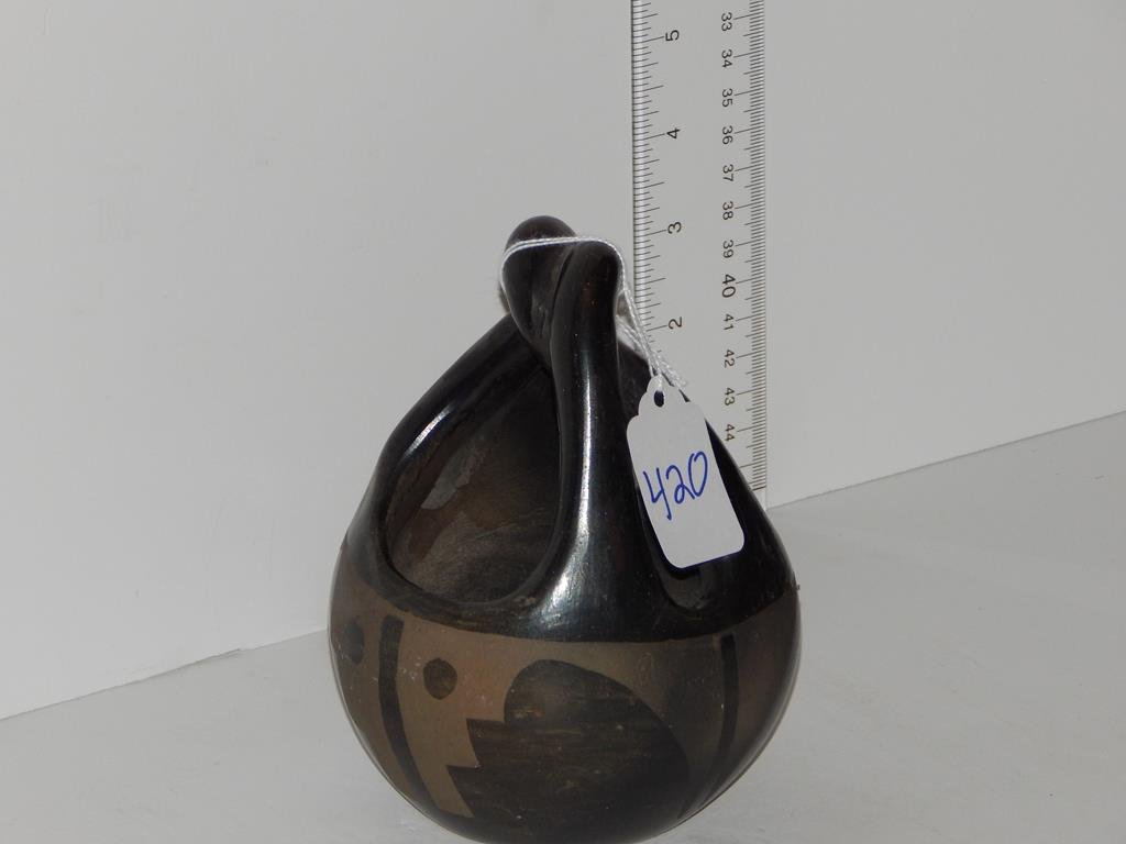 Two pieces of Native American pottery, pot is 4 1/4"H,: Two pieces of Native American pottery, pot is 4 1/4"H, basket is 5 1/2"H condition is good one is signed "Gloria L."