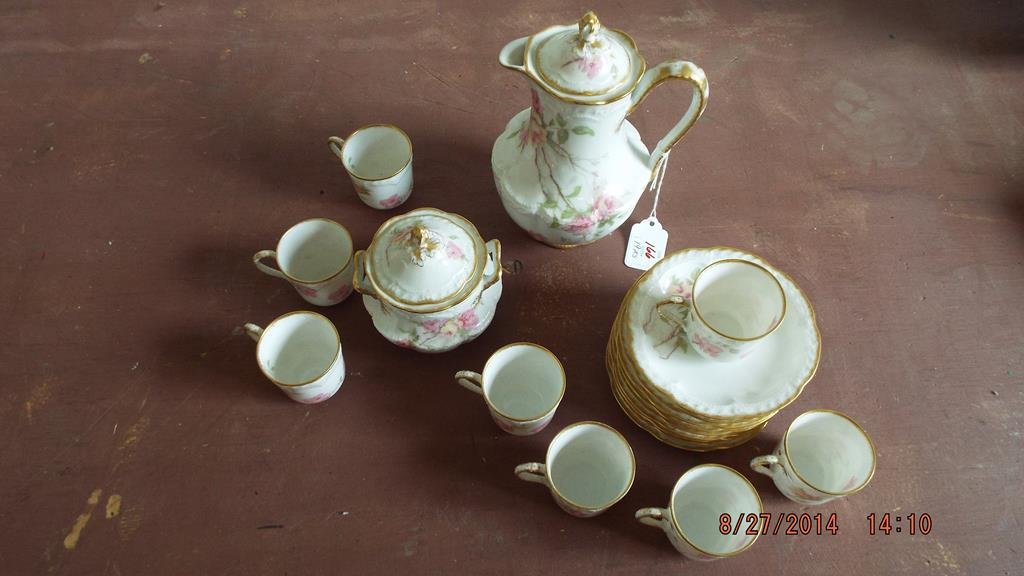 Nineteen piece Haviland France tea set, teapot, covered: Nineteen piece Haviland France tea set, teapot, covered sugar bowl, 9 saucers and eight demitasse cups, simple rose decoration, condition is good no ref.#