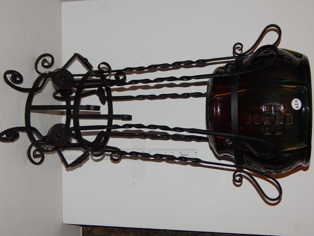 Pottery jardinière (probably Ohio) with an decoarative: Pottery jardinière (probably Ohio) with an decoarative wrought iron stand, more than likely not original, jardinière is 10"H 10 1/2"D, overall height is 32 1/2"H ref.#1124