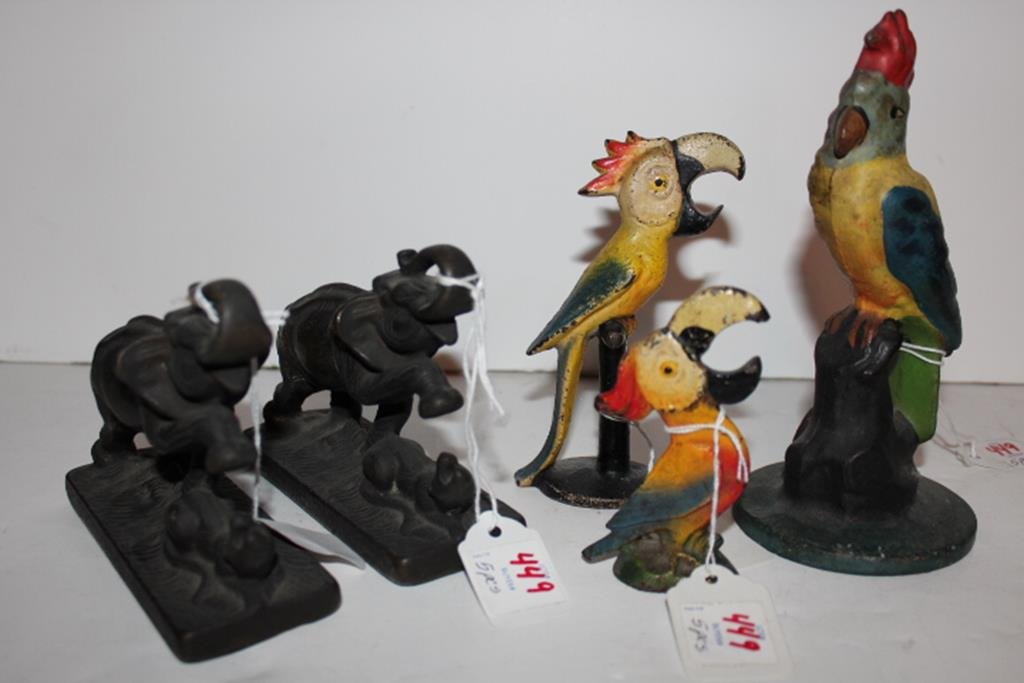 Five pieces, pair of brass elephant bookends (depicts: Five pieces, pair of brass elephant bookends (depicts an elephant raising its foot over a rat) 4"H 5 1/4"L, two cast iron figural (parrots) bottle openers with original paint 3 3/4"H & 5 1/4"H and a p