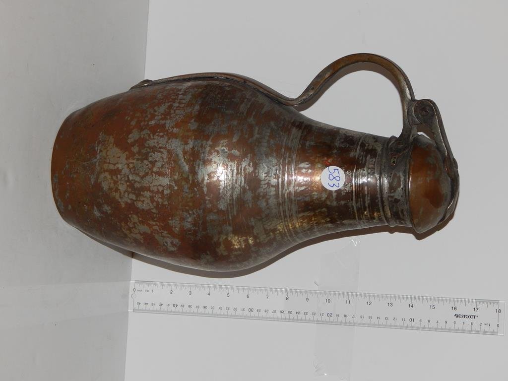 Two pieces, Turkish copper pot with hand wrought iron: Two pieces, Turkish copper pot with hand wrought iron handle, pot has extensive detail 6 1/4"H 7 1/4"D and a metal Turkish water jug 17 3/4"H ref.#583,656