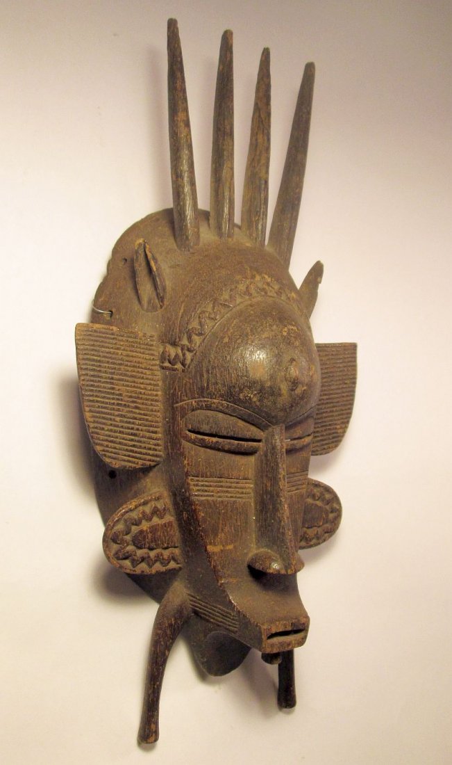 a Fine old Senufo Kpelie African mask: This is a very rare and beautiful carved wooden mask from the Senufo peoples of Mali, West Africa. The mask is known as "kpelie" by the tribe. The mask is very finally carved, you will note when holdi