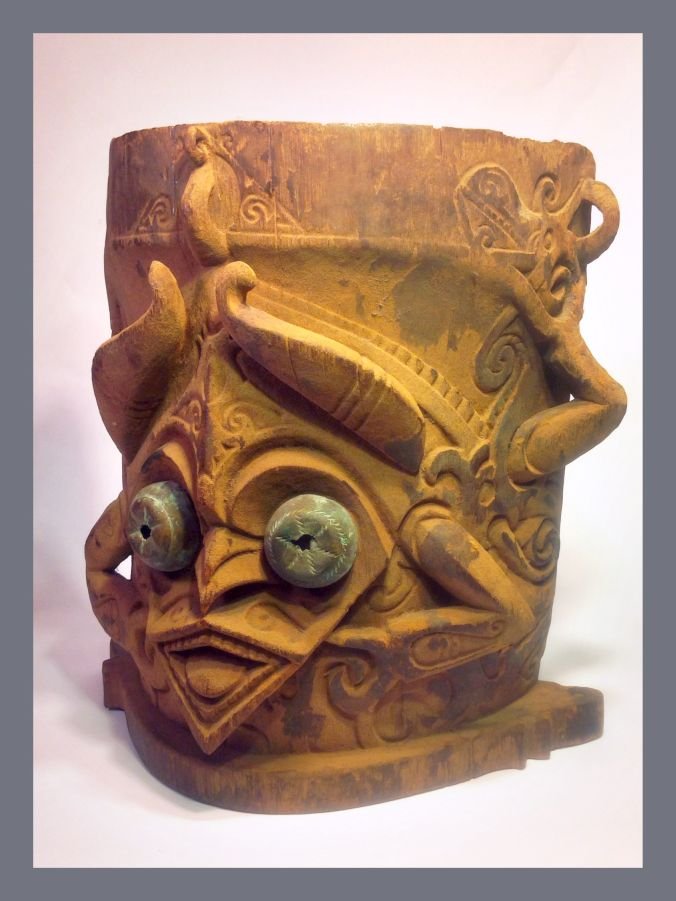 Old Dayak Baby carrier, Indonesian Tribal Art: Carved wooden back pack type carrier for children from the Dayak cultures of Borneo / kalimantan / Indonesia. The Aggressive face of a demon/ dragon figure adorns this impressive old carrier or "Ba'",