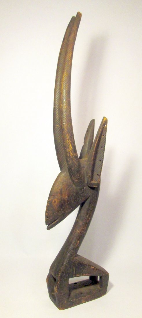 Old Chiwara antelope headdress from the Bamana peoples: Old Chi Wara headdress from the Bamana peoples of Mali, West Africa.A traditional example carved from a single piece of wood, with a highly stylized form of an antelope. This sculpture was worn atop o