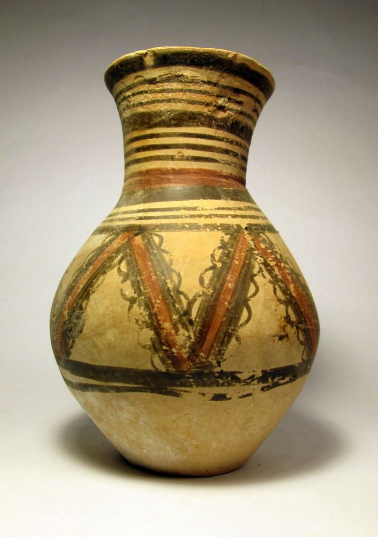 Ancient Chinese Earthenware Jar, Neolithic period: Gorgeous and mint ancient clay vessel from China, dating back 4000 years. Features elaborate design and classic form with flared rim. Measures 7 1/4 x 5 1/4 inches.Machang Phase of the Majiayao cultur