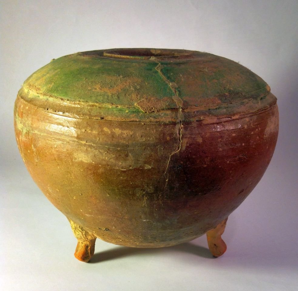 Ancient Chinese Ceramic Jar with 3 legs: Large earthenware ceramic vessel with Brown and greenish glazes. Likely 12 th century or earlier.Measures 6 1/2 inches tall x 8 inches wide.Ex~ Steve Tobin Collection, Pennsylvania , USA