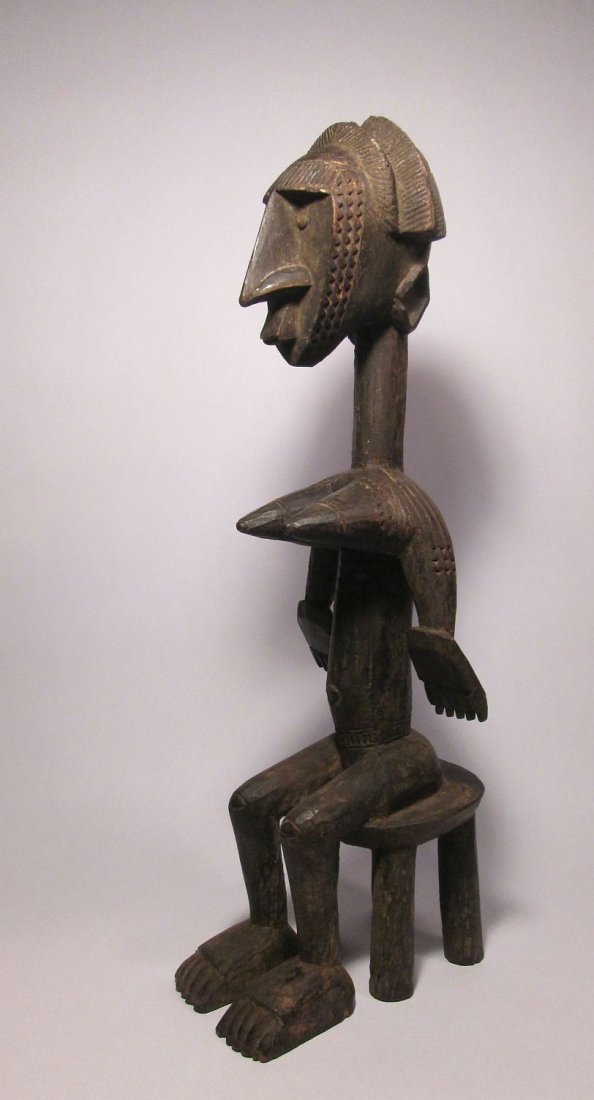 a Very Fine Bamana Jo Society Seated female figure: In May of 2012 Sothebys sold a figure quite similar to this that was in the Henry Matisse collection for $782,000.00 attributed to the "master of the raptor profile"..... A very Fine Bamana Jo society