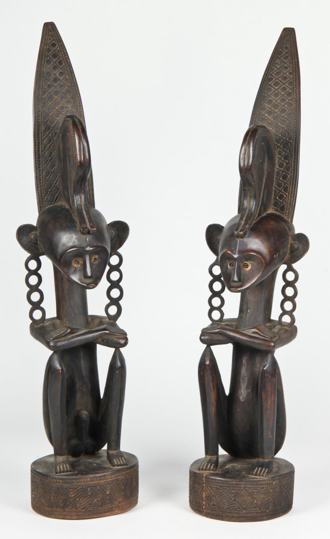 Finely carved pair of Timor island Ancestors: Pair stylized carved wood Timor figures collected in Indonesia in 1994. Size: 36" x 8" x 8" (91 x 20 x 20 cm)