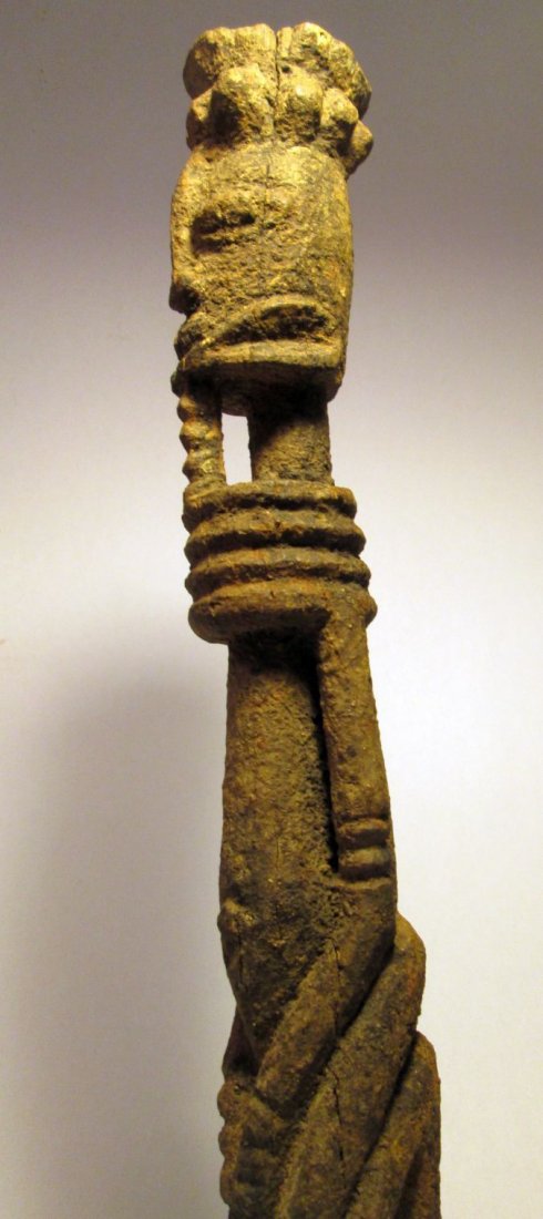 Old Dogon Kneeling Shrine idol, African Tribal Art: Carved wooden idol from Mali, Africa. Stylized kneeling ancestor idol with heavy sacrificial patina. Such idols are typically used on personal household shrines. Measures 17 inches tall. 4 lb shipping