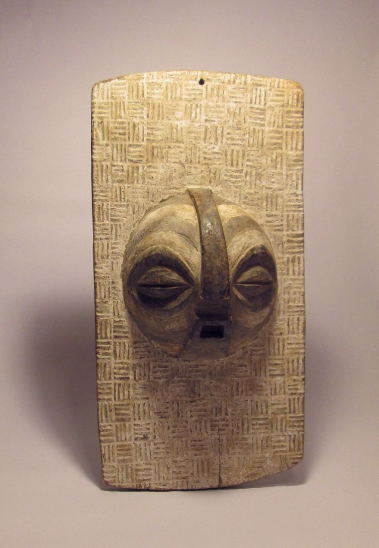 old LUBA Kifwebe society panel with Tribal Mask face: This is a rare old carved wooden panel featuring a Kifwebe society mask from the Luba peoples of the Congo, central Africa. Note the age and wear, and the intricate design , certainly appears to be a 