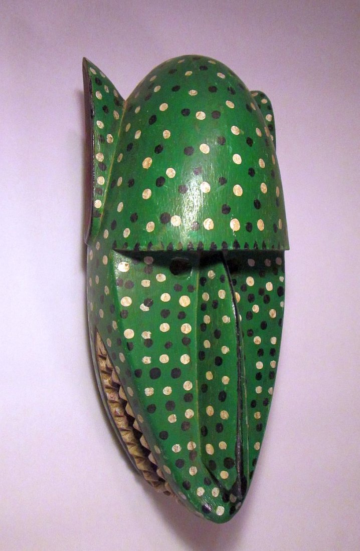 Bozo Green Painted Hyena mask, African Tribal Art: Carved wooden Mask from the Bozo peoples of Mali, West Africa. Painted Green Hyena Masks with various colored spot accents. Measures 16 inches tall x 8 inches wide and has a 4 lb shipping weight