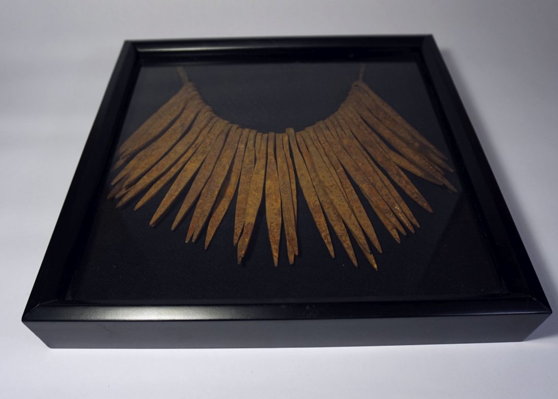 Old Kirdi Iron Skirt Sex Cache in Shadow Box, African: Old iron Skirt worn by the women of the Kirdi peoples, Nigeria, Africa. Set into a black shadow box with glass front. Ends of skirt are gathered in back of shadow box and it was wired to hang, looks g