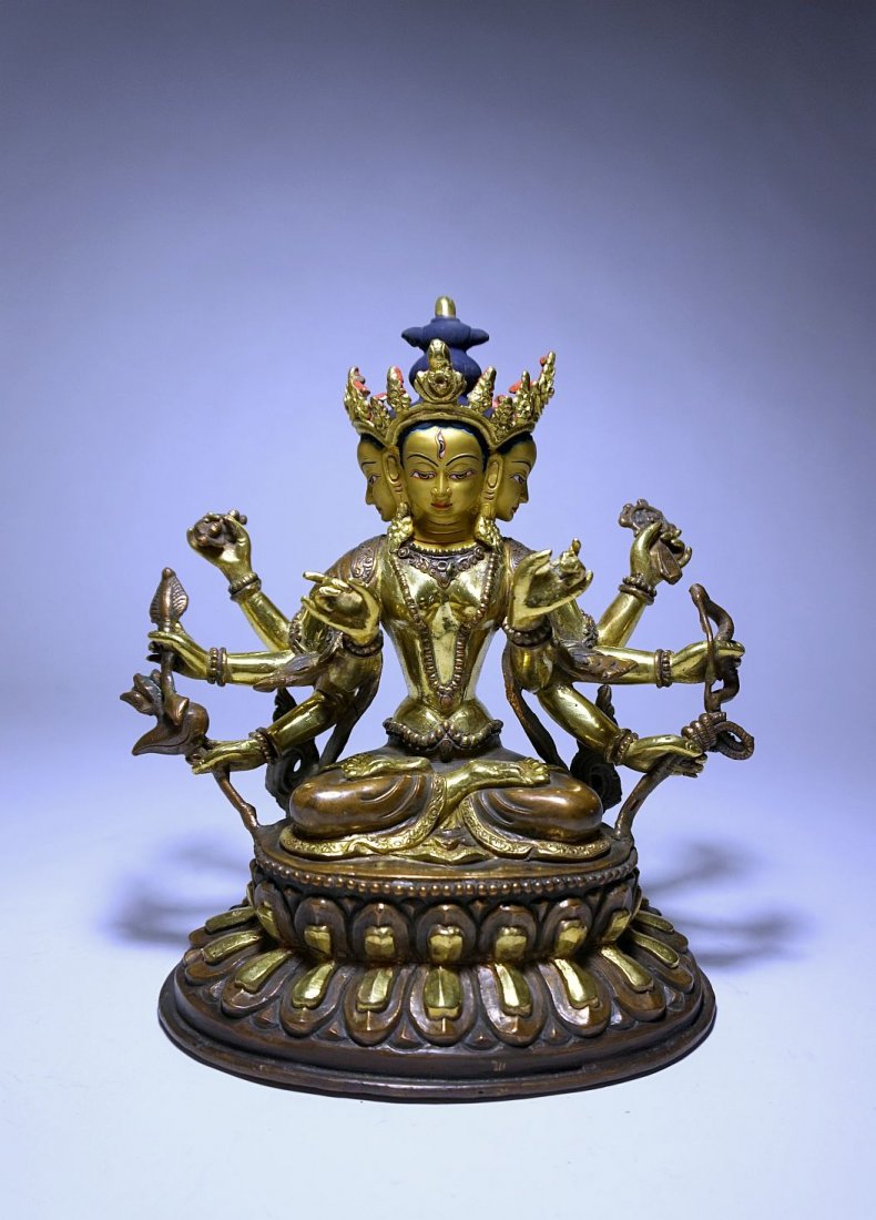 Tibetan Gilt Bronze statue, Buddha with 8 arms 4 heads: Gorgeous Vintage Buddhist sculpture from Tibet or Nepal. This is a stunning high quality gilt bronze with serene facial expressions and incredible details. The bronze features a multi headed Buddhist 