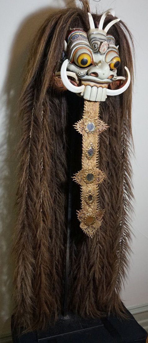 Amazing Balinese Witch mask, Real Boars Tusk Dance mask: Carved wooden mask with real Boars tusk accents from Bali, Indonesia. Authentic dance mask made for use, not a typical tourist example. Long attached fiber hair and ornate carving and painting style. 