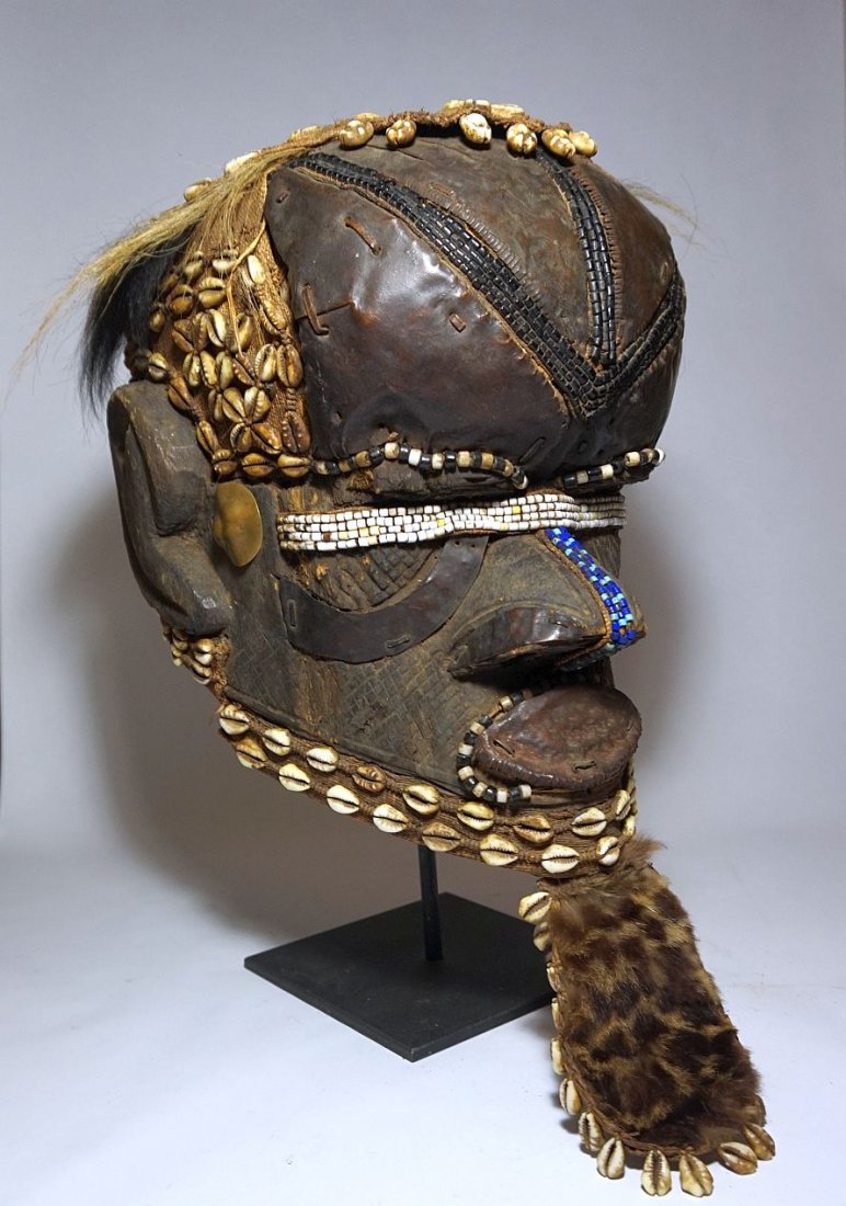 Kuba Bwoom Helmet mask, African Tribal Art: Carved wooden helmet mask from the Kuba peoples of the Congo, Central Africa. Large traditional dance mask adorned with beads, shells and hand hammered copper regalia. Measures 18 x 12 x 9 inches. A g