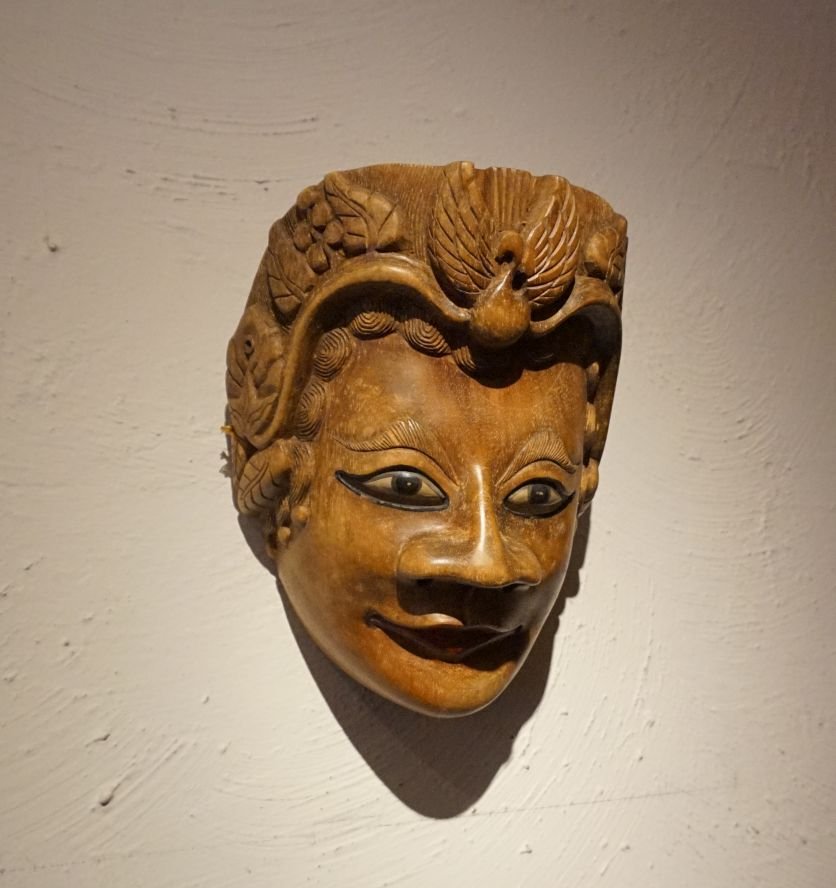 Very fine old Java Topeng mask with Royal Insignia: This is a very fine Old Javanese Topeng or Dance mask from Indonesia. This mask has a wonderful realistic quality and some elaborate decoration. There is some type of royal insignia in the back carved