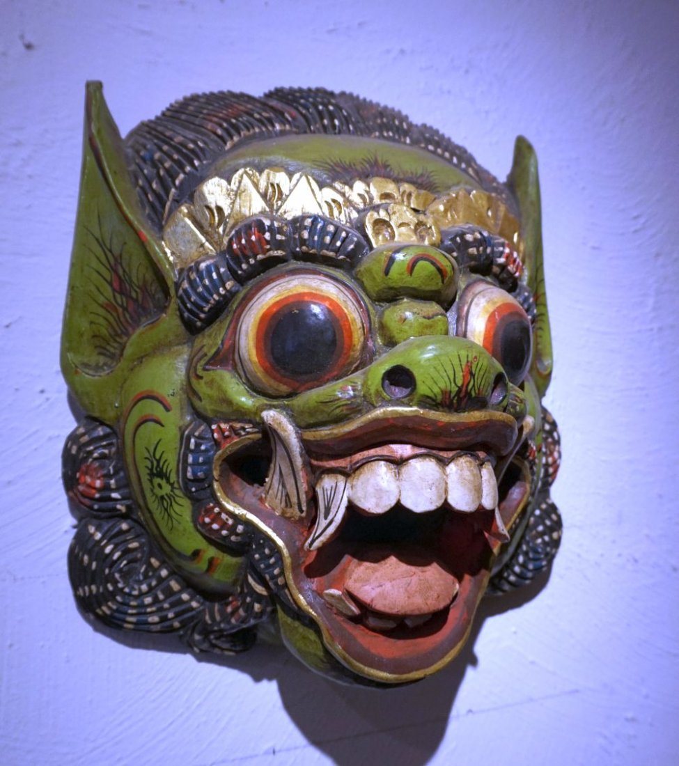 Balinese Demon mask , carved wooden mask: Carved wooden mask in the form of a Demon face with aggressive teeth and bulging eyes. Vintage hard wood carving from Bali, Indonesia Measures 10 1/2 x 9 1/4 inches.