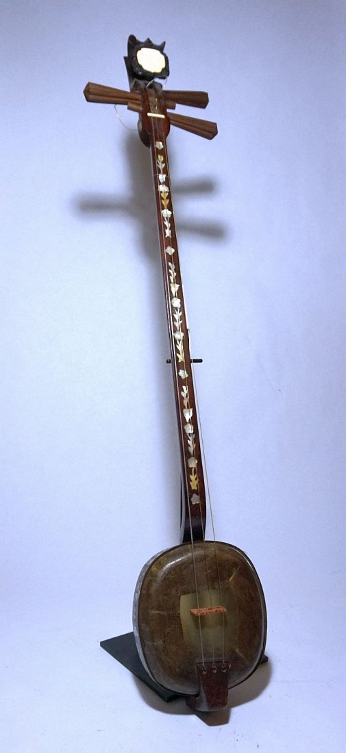 Very Fine Dan Tam Banjo from Vietnam with inlaid shell: A Gorgeous Dan Tam stringed instrument from Vietnam. This three-stringed banjo-lute is used by several ethnic groups in Vietnam. It is quite similar to the Chinese sanxian, and a relative of the Japan