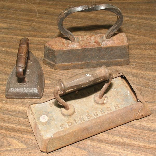 Lot of three irons, cast iron, (1) large heavy ir: Lot of three irons, cast iron, (1) large heavy iron in holder, Morrison & Co., Edinvurgh, 11" x 6", (2) large heavy 10", #16, (3) #7, 6" long.