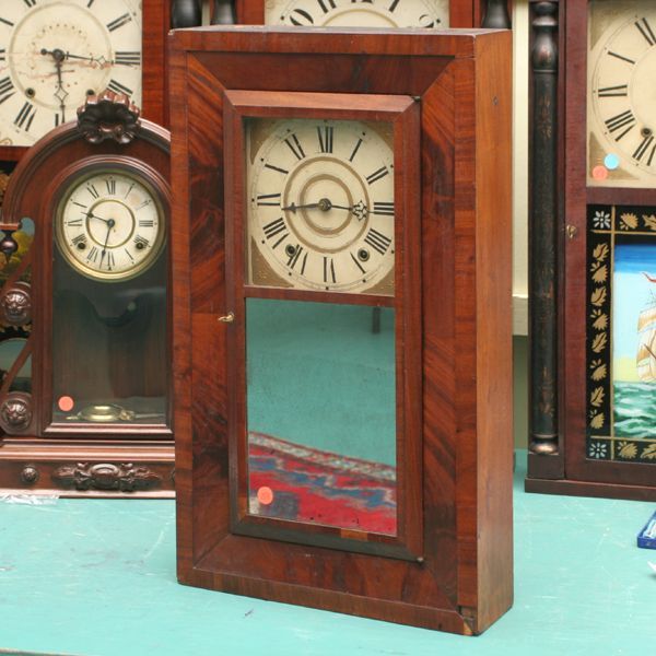 Early 1840 Empire ogee mantle clock, mahogany, Oli: Early 1840 Empire ogee mantle clock, mahogany, Oliver Weldon for Charles Stratton ??, Mass., wooden double weight movement, original gilt/wooden dial, original mirror door, 26"t 15"w 4 1/2"d. Original