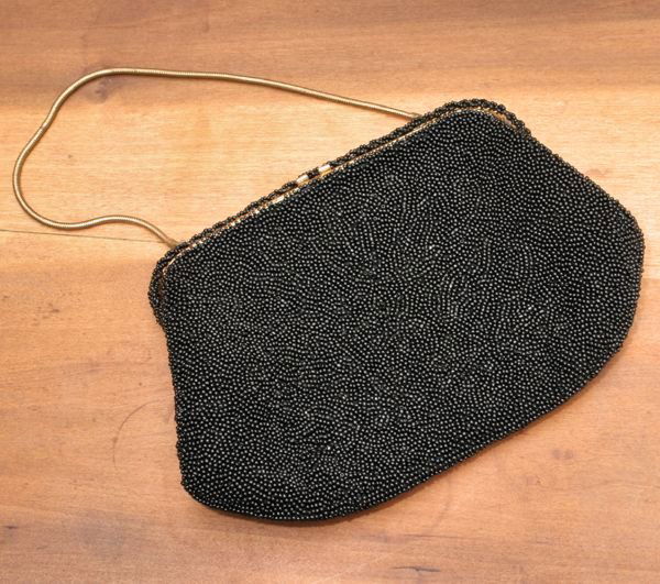 Early 1900's small purse, "Jorelle Bags", France,: Early 1900's small purse, "Jorelle Bags", France, black beaded body, 8 x 5 1/2.