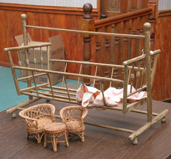 Victorian swinging doll cradle, stick and ball mo