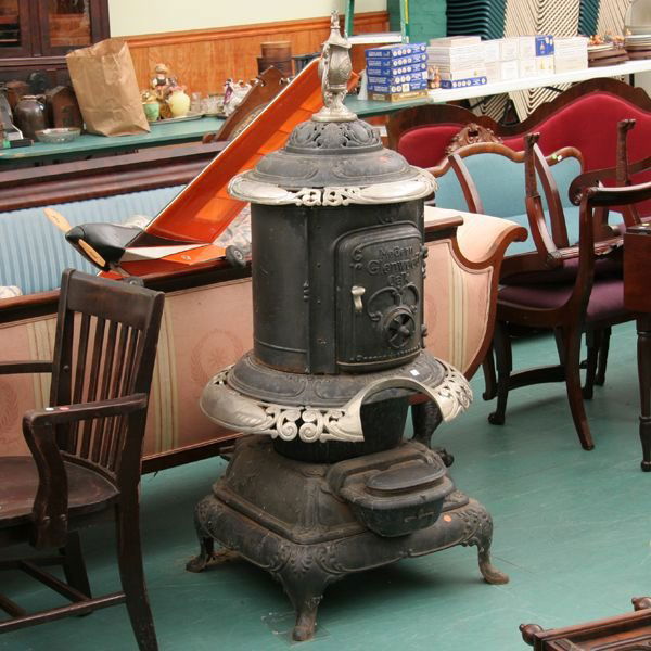 19th Century cast iron pot belly stove, "Weir Sto: 19th Century cast iron pot belly stove, "Weir Stove Co., Taunton, Mass., No. 116", 60" tall, "Modern Glenwood Oak", on front door, chrome plated ring around center, top ring and large finial on dome t