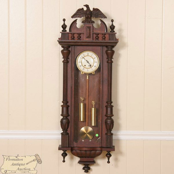 Late 1800 large Vienna regulator wall clock, doubl: Late 1800 large Vienna regulator wall clock, double weight, walnut, brass movement, fluted turned columns, large eagle finial, bracketed base, 53"t, 16"w, 7"d. Original finish, recent brass movement.