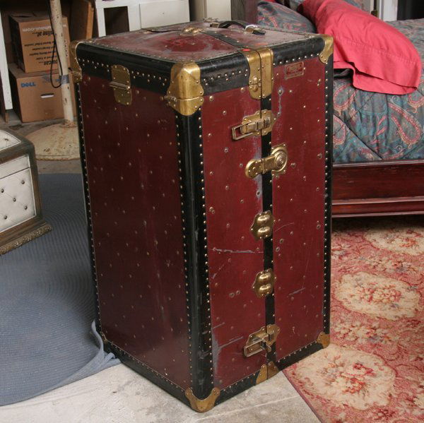 Large steamer trunk, "The Indestructo Trunk Co, M: Large steamer trunk, "The Indestructo Trunk Co, Mishawaka, IN", 42"t, 22"sq. Original condition, locked.