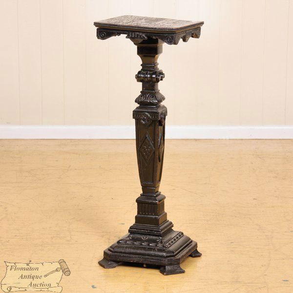 Late 1800 aesthetic Victorian pedestal, ebonized f: Late 1800 aesthetic Victorian pedestal, ebonized finish, shaped square pedestal, shell carvings and rosettes, 14" square, 39"t. Some finish loss, age split on top.