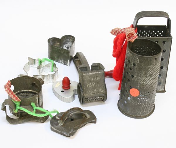 Lot of nine pieces tin kitchen ware, five cookie: Lot of nine pieces tin kitchen ware, five cookie cutters-two hearts, two birds, and rooster, four graters. ………………We are a live "brick/mortar" auction house, as such we are selling to a liv