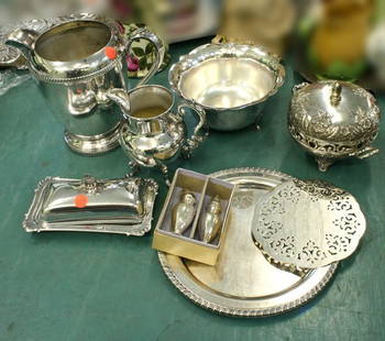Ten pieces assorted silver plate, various brands,: Ten pieces assorted silver plate, various brands, 8" water pitcher, 6" footed creamer, covered butter dish, tongs 5", salt and pepper, 8" footed bowl, 6" trivet, 10" plate, 6" footed covered bowl.