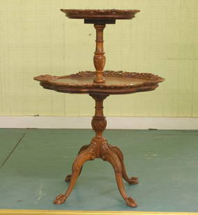 Mid 1900 Chippendale revival two tier end table,: Mid 1900 Chippendale revival two tier end table, mahogany, reticulated carved scalloped edges, carved pedestals and arched legs, ball and claw feet, 35"t 24" diameter. Refinished, missing 8" of