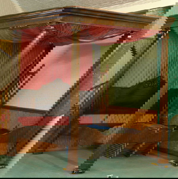 Mid 1800 Southern canopy bed, in manner of C. Lee,: Mid 1800 Southern canopy bed, in manner of C. Lee, mahogany, 110"t, adapted to modern king size bedding, tapered 6 1/2" octagon post, shell and scroll carved panel headboard, acorn finials, scrolled f