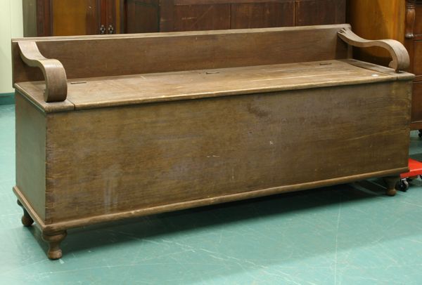 Mid 1800 Empire wood box/settee, dove tail case, l: Mid 1800 Empire wood box/settee, dove tail case, lift top, 7" back with unusual ogee scroll arms, turned feet, 69"l 30"t 20"d. Old weathered finish, wood loss at back of right arm.
