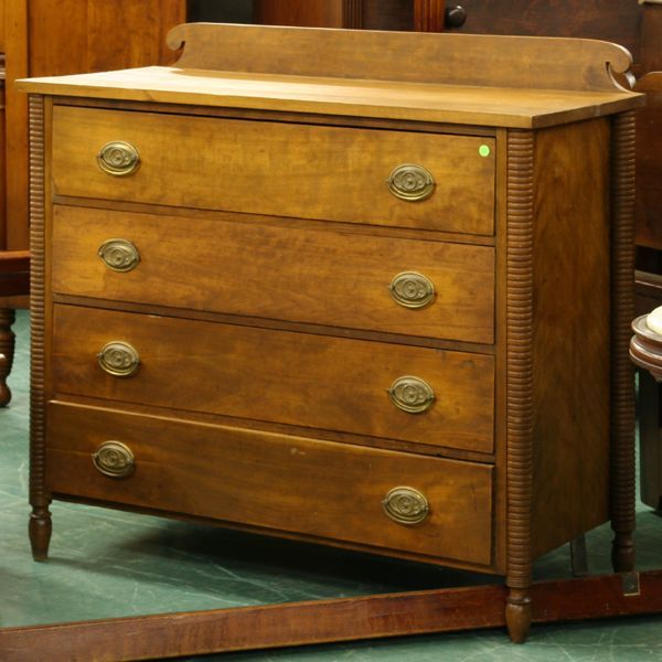 Early 1800 Sheraton four drawer chest, flaming bir: Early 1800 Sheraton four drawer chest, flaming birch front and sides, ring turned turret corners and legs, 4"t scroll back, dove tail case, 44"w 37"t 20"d. Later finish and brass oval pulls with Eagle