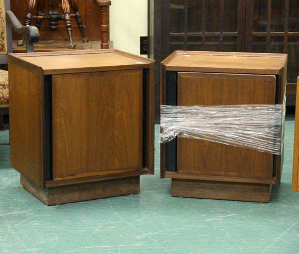 Lot of three mid 1900 modern style side cab: Lot of three mid 1900 modern style side cabinets, walnut, (1) pair of Dillingham, drawer behind door, molded edges, 20"w 15"d 23"t, one with hinge broken, (2) single drawer end table, walnut, 16"w 18"
