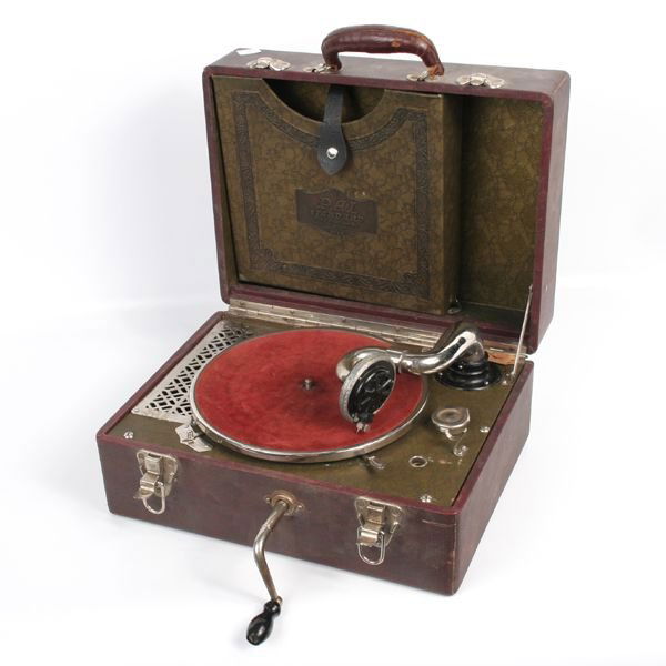 Mid 1900's portable record player, Plaza Music Co: Mid 1900's portable record player, Plaza Music Company, New York, Pal Standard, leatherette embossed case. Head casting damaged.