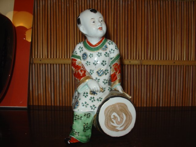 Chinese ceramic boy sitting on the drum: Size: W 5 x D 3 1/2 x H 9 inches
