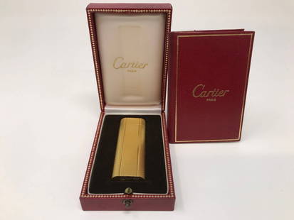 Vintage Cartier Paris Gold Plated Lighter Box: Vintage gold plated Cartier Paris lighter in the original box and with an instruction booklet. Pre-owned but it excellent condition