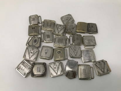 Art Deco Silver Plated Set of 24 Belt Buckles: Art deco silver plated belt buckles, set of 24. Some have letters, measures 1.5 inches x 1.5 inches.