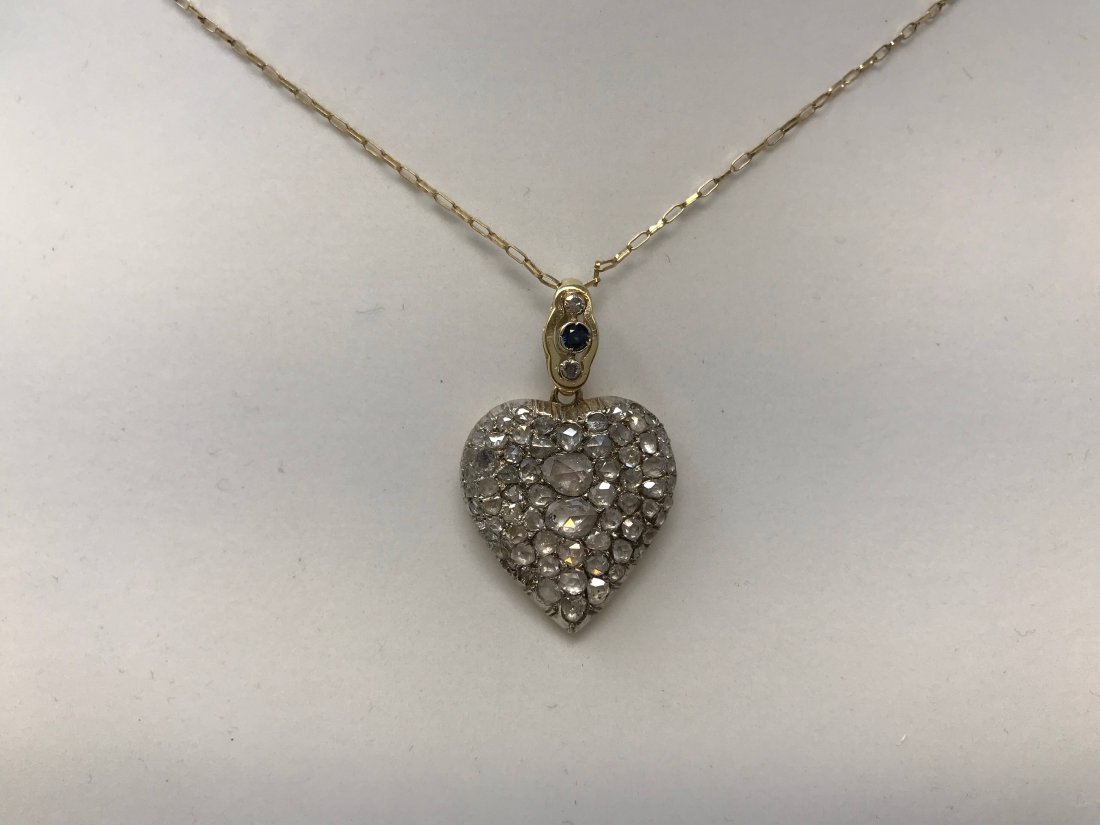 Antique Victorian 18k Pendant Rosette Cut Diamonds: One antique pendant, Victorian era (1850-1900).18k gold and silver (acid tested). In the style of a heart, paved stone setting, the body is yellow 14k, polished finish with a total weight of 8.6 grams