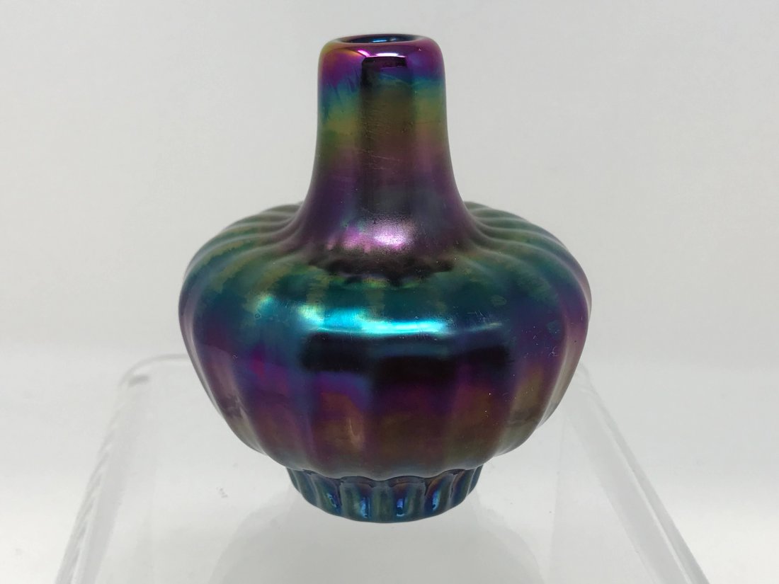 Canadian James Norton Mini Iridescent Vase: Canadian Jim Norton mini iridescent vase. Measures 3 inches x 2 1/2 inches in diameter.